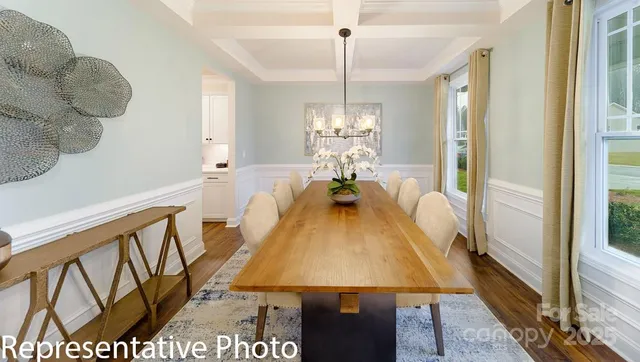 a very nice looking room with a large window and wooden floor