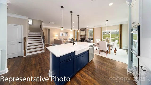 a kitchen with a sink a counter top space and appliances