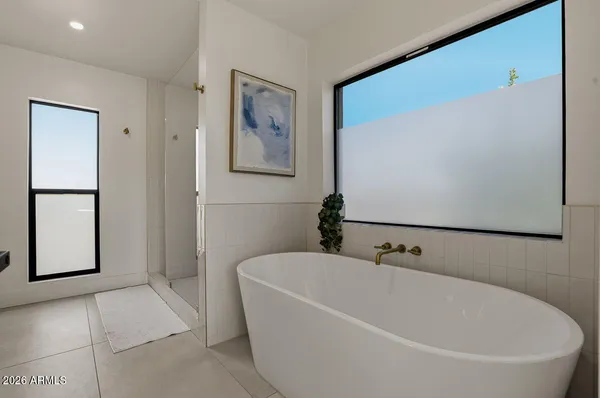 a white bath tub sitting in a bathroom