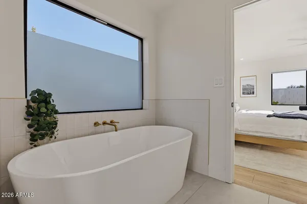 a white bath tub sitting in a bathroom