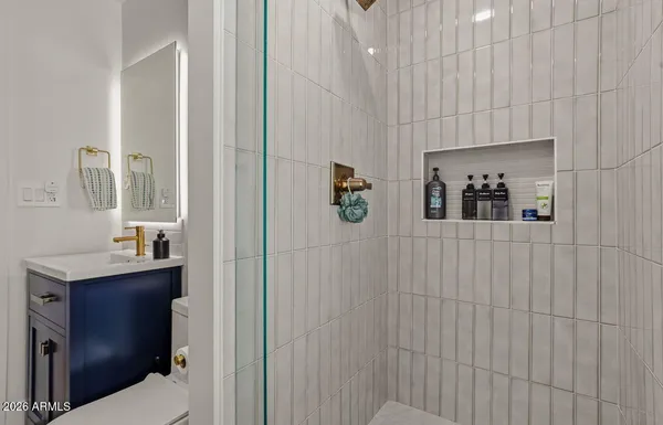 a bathroom with a sink and mirror