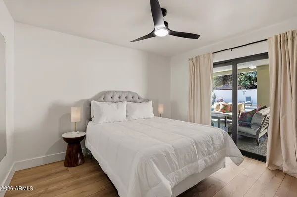 a bedroom with a bed and a table