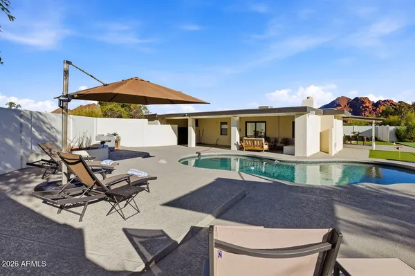 a view of house with patio outdoor seating