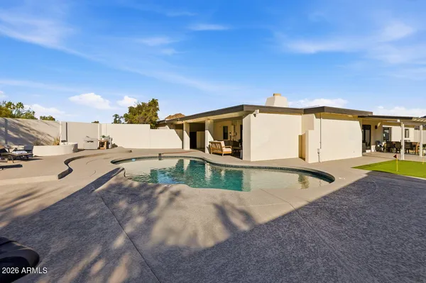 a view of a house with swimming pool