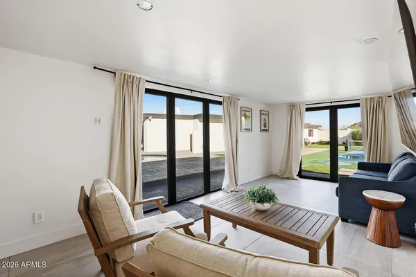 a living room with furniture and a large window