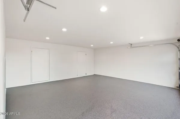 an empty room with a empty space and windows