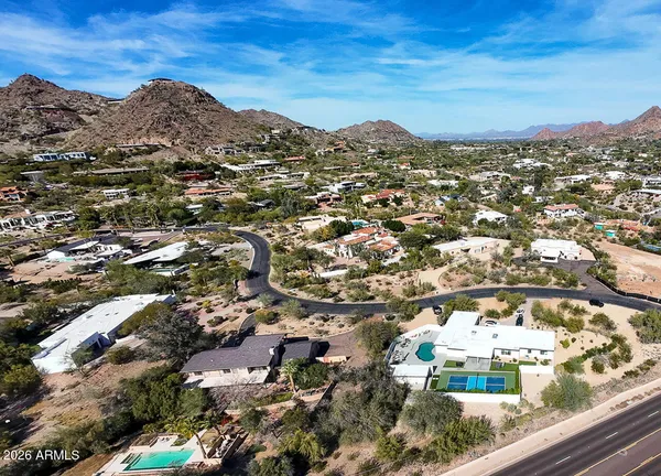 an aerial view of residential houses with outdoor space