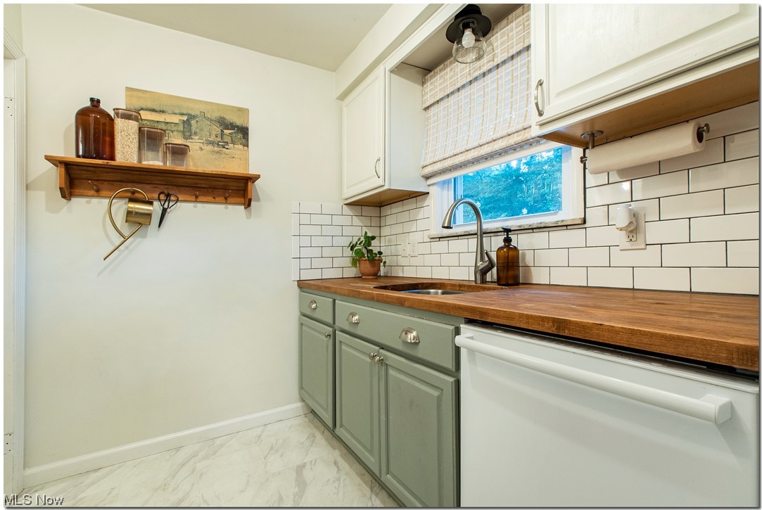 1430 West Miner Road Cleveland, OH 44124 - Photo 9 of 32 Kitchen with sink, butcher block counters, new dishwasher