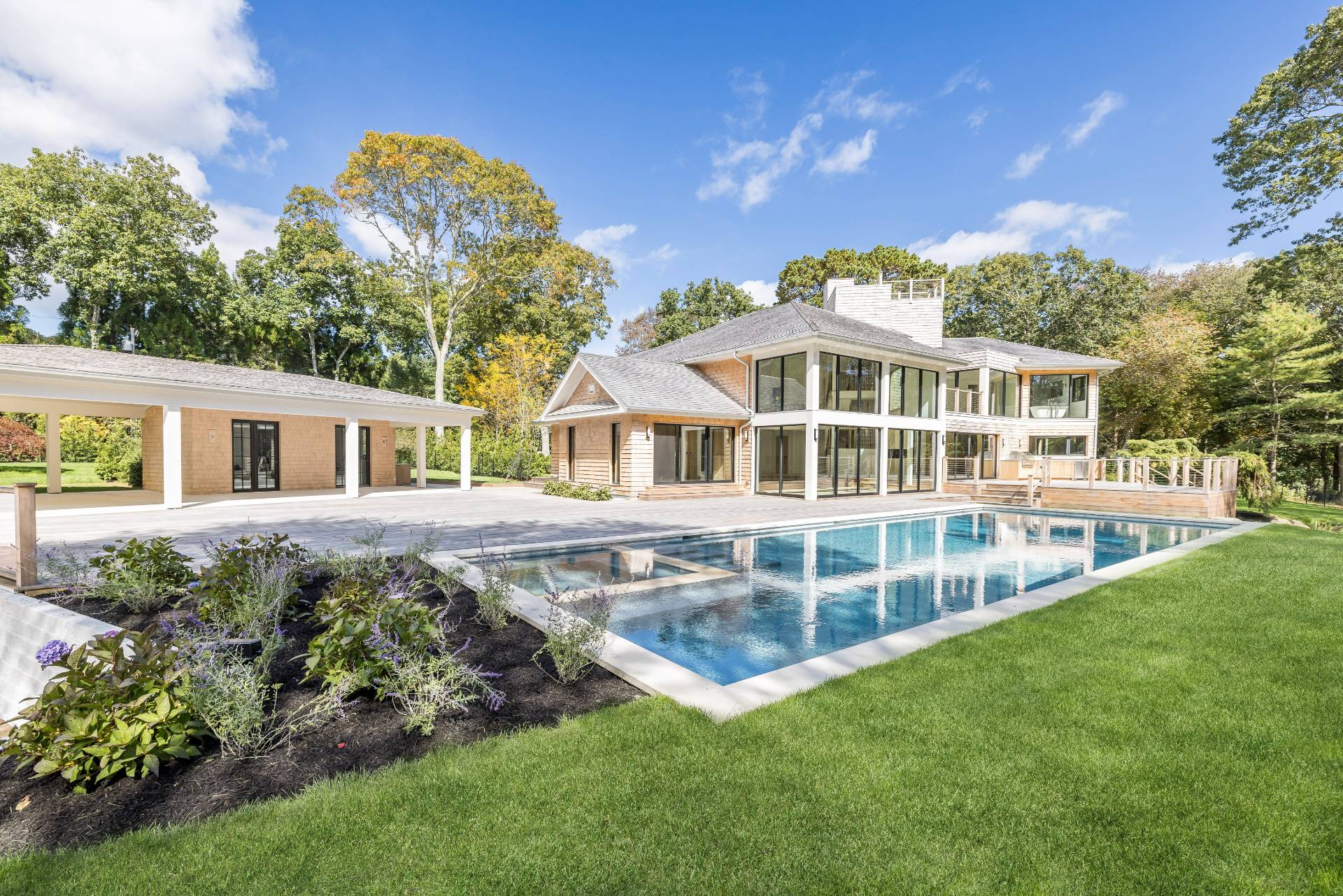 104 Georgica Close Road East Hampton, NY 11937 - Photo 23 of 46 a view of a house with a swimming pool