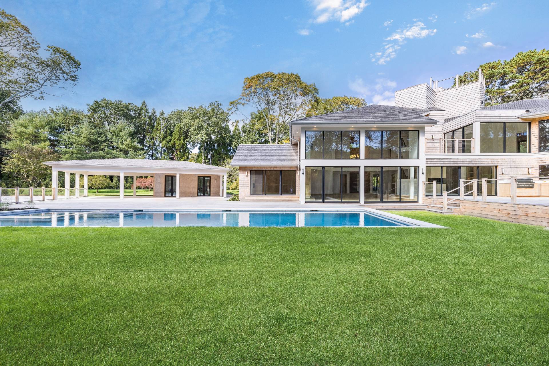 104 Georgica Close Road East Hampton, NY 11937 - Photo 38 of 46 a front view of a house with a garden