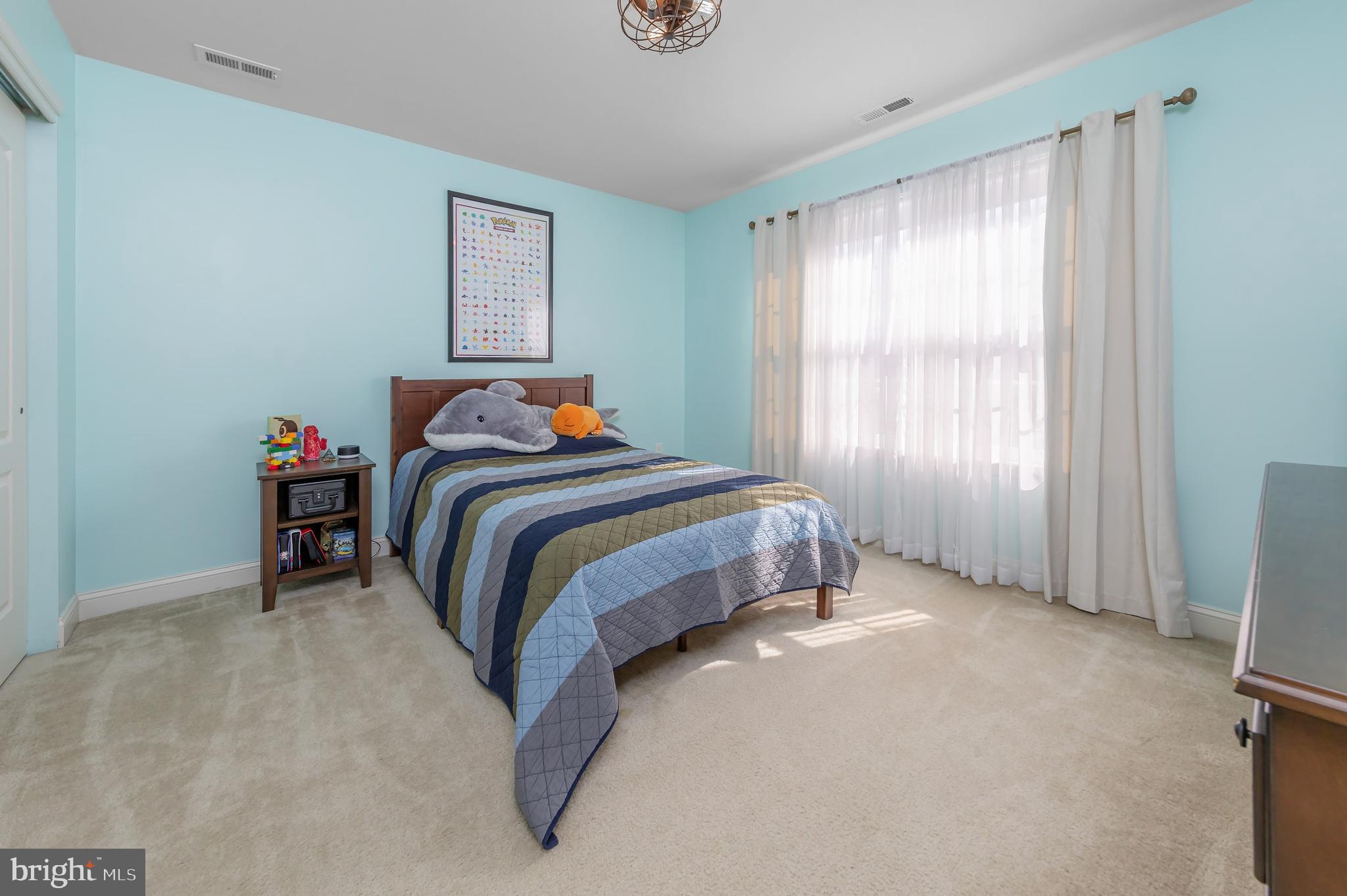 112 Robert Botto Way Clarksboro, NJ 08020 - Photo 21 of 60 a bed sitting in a bedroom next to a window