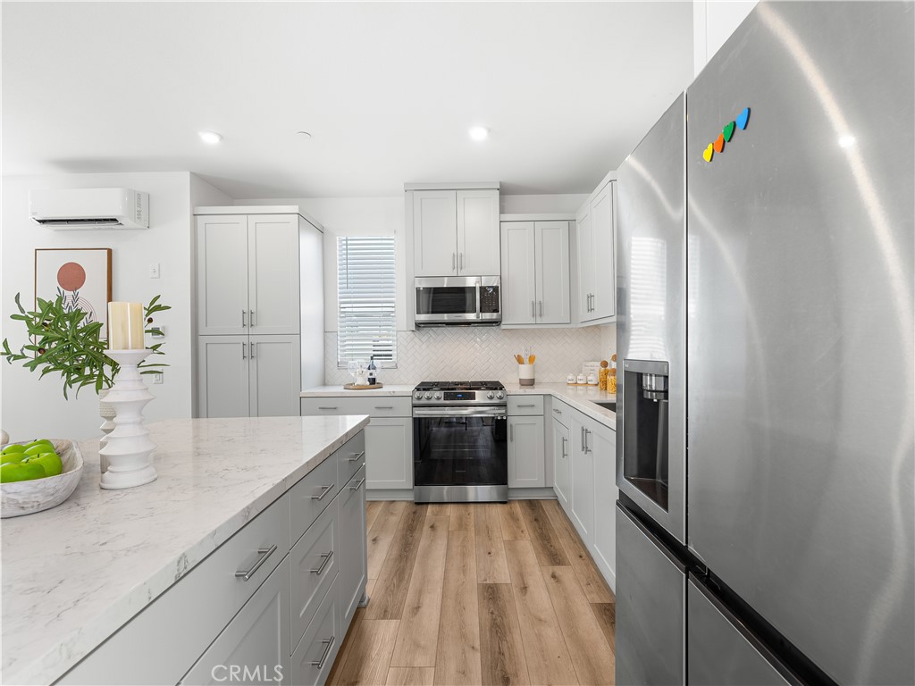 191 Lynx Irvine, CA 92618 - Photo 5 of 26 a kitchen with a sink stainless steel appliances and cabinets