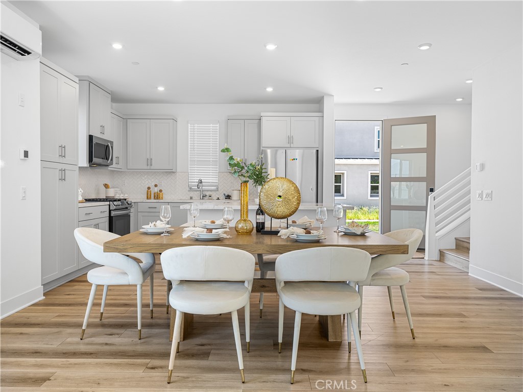 191 Lynx Irvine, CA 92618 - Photo 8 of 26 a view of a dining room with furniture and wooden floor