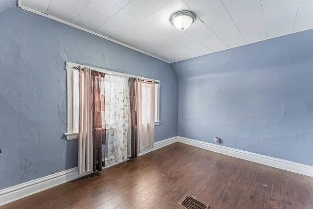 a bed room with furniture and a dresser