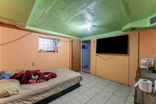 a bedroom with furniture and a bed