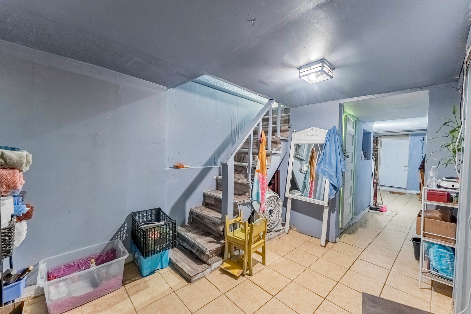 6933 South Michigan Avenue Chicago, IL 60637 - Photo 22 of 29 a view of entryway with stairs and furniture