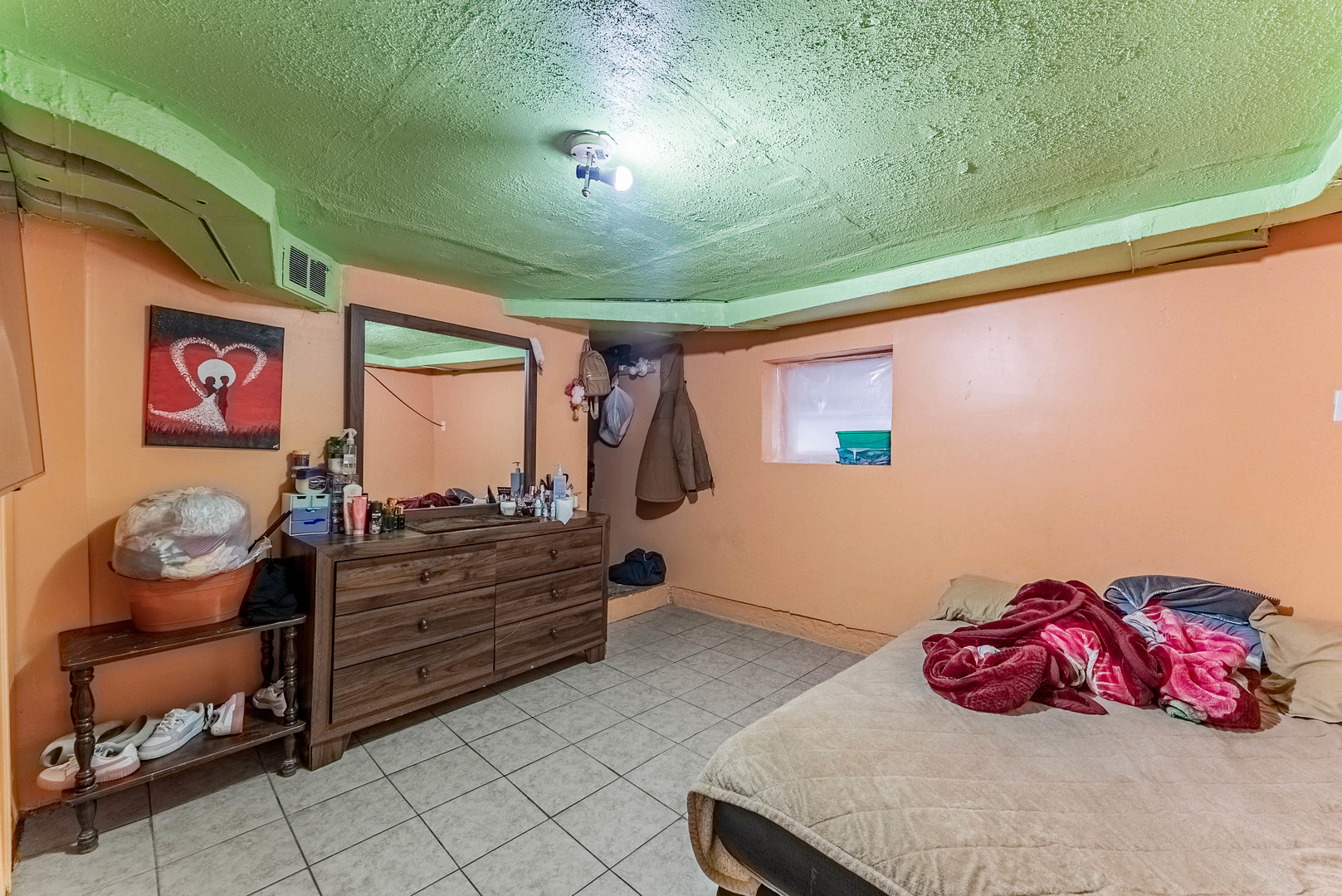 6933 South Michigan Avenue Chicago, IL 60637 - Photo 24 of 29 a bedroom with a bed and window