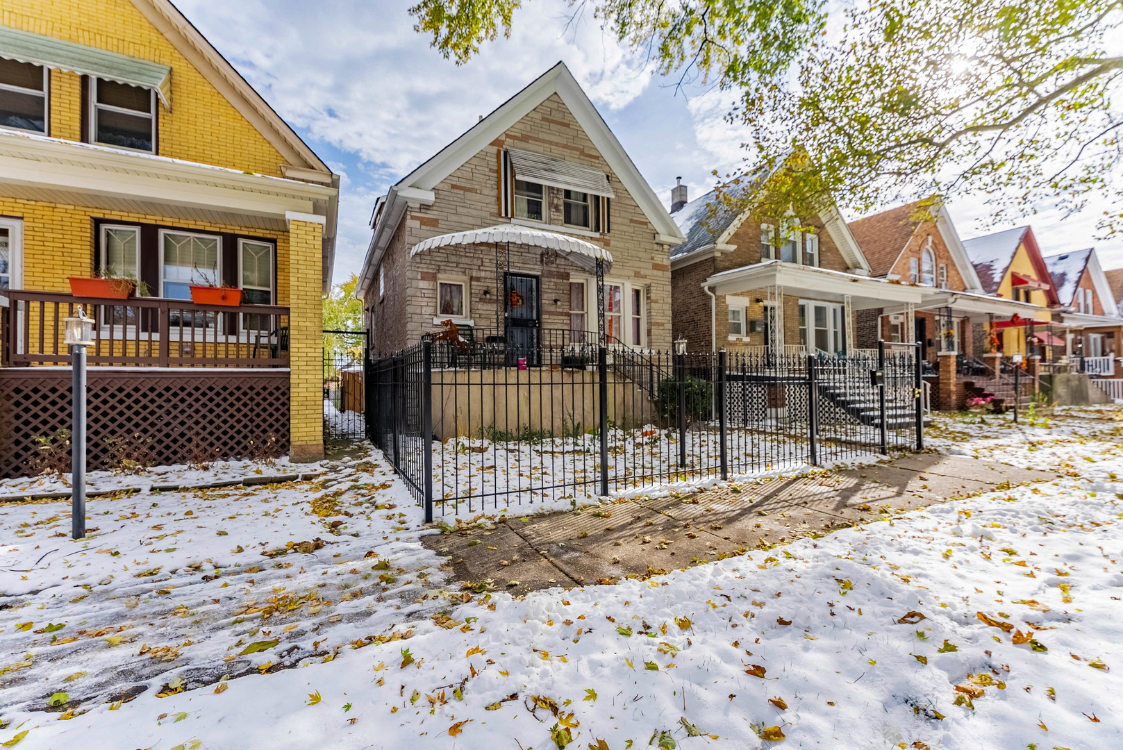 6933 South Michigan Avenue Chicago, IL 60637 - Photo 3 of 29 a front view of a house with a porch