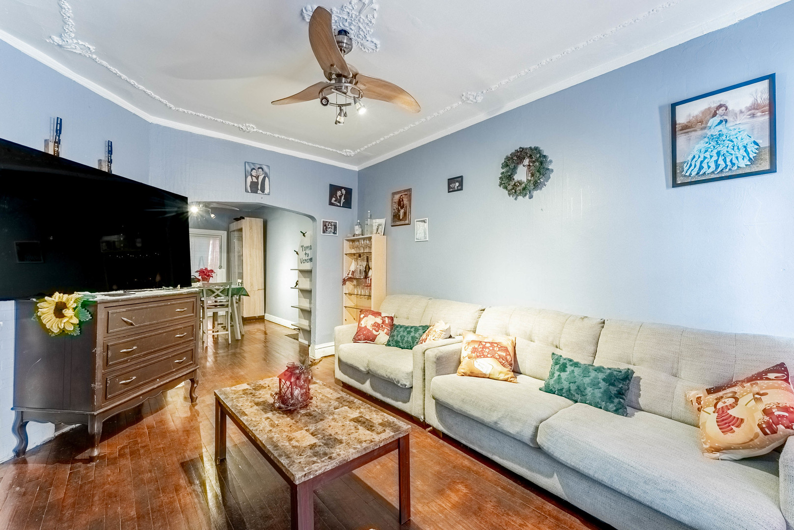 6933 South Michigan Avenue Chicago, IL 60637 - Photo 8 of 29 a living room with furniture and a flat screen tv