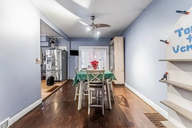 a kitchen with stainless steel appliances kitchen island granite countertop a stove a sink dishwasher and a refrigerator