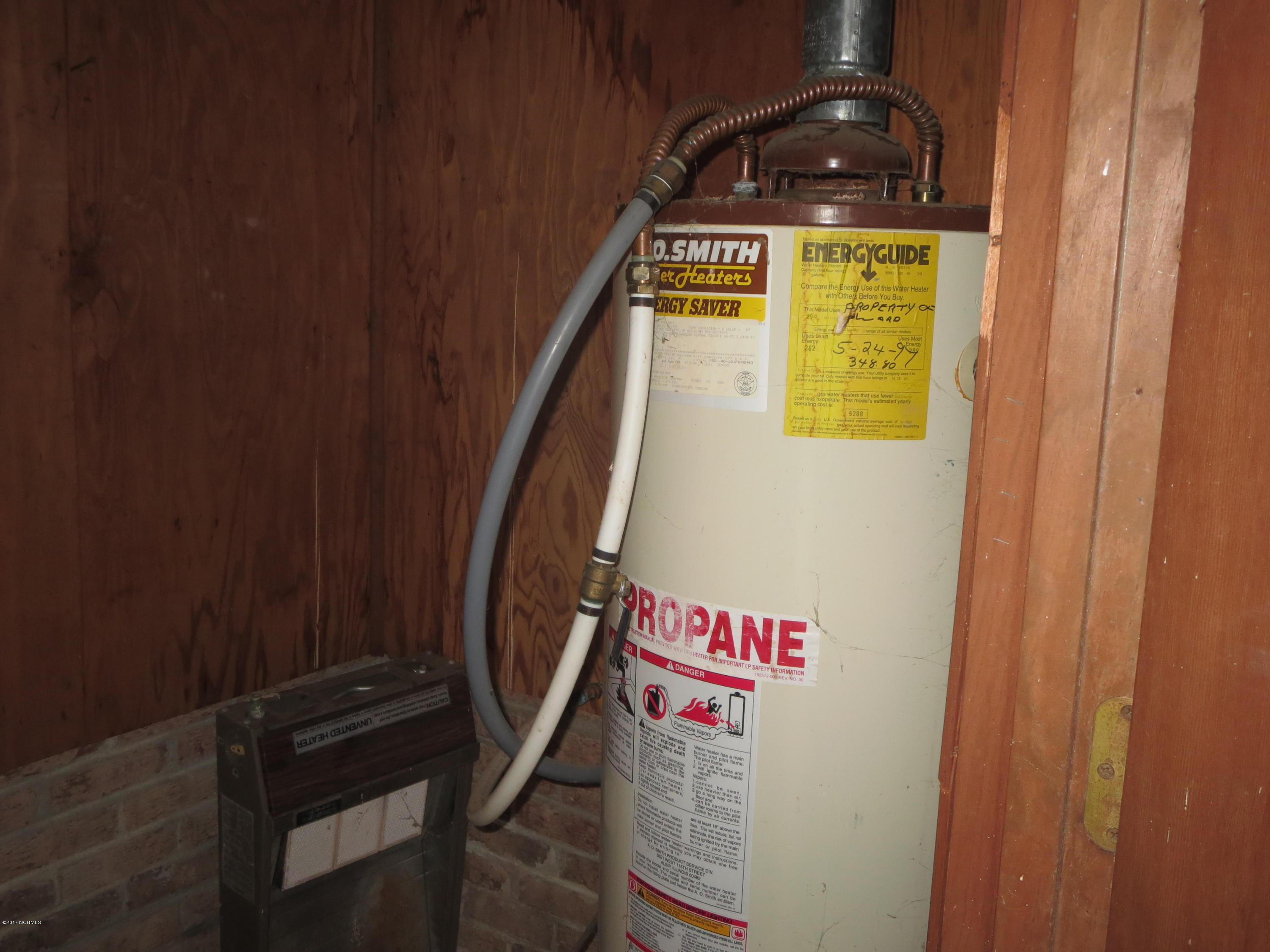3327 Hobgood Road Hobgood, NC 27843 - Photo 4 of 33 gas water heater in storage room in garage
