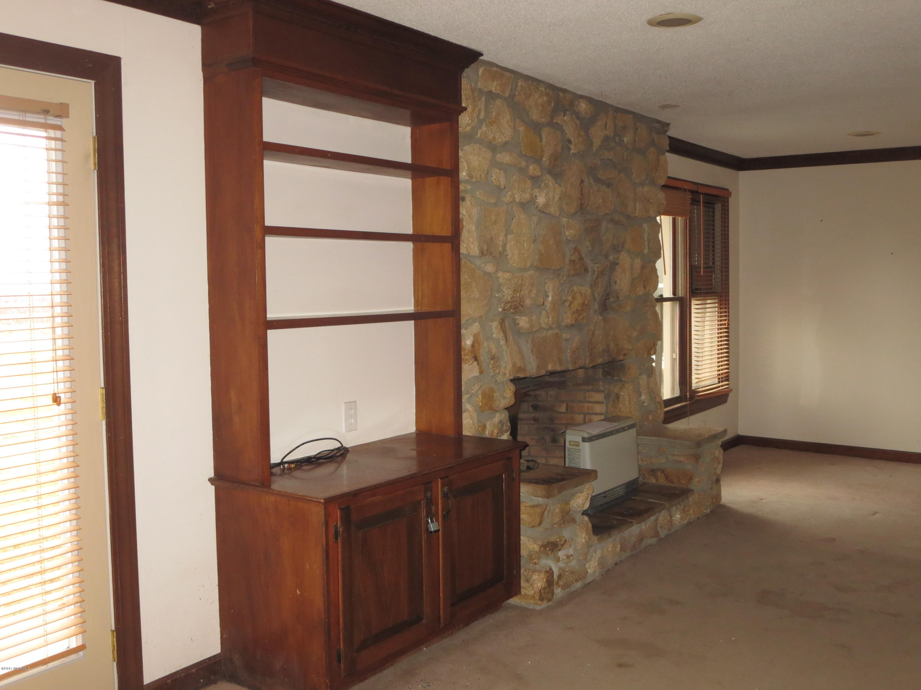 3327 Hobgood Road Hobgood, NC 27843 - Photo 9 of 33 den, built-ins, french door, fireplace