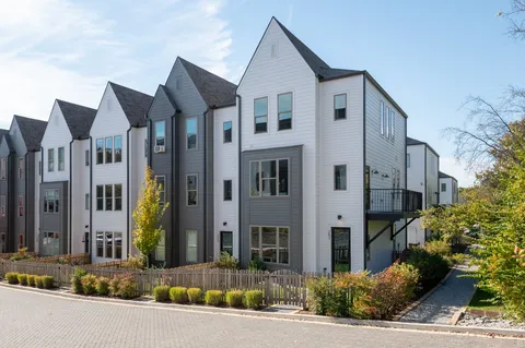 a view of a white building among the street