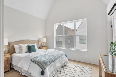 a bedroom with a bed and window