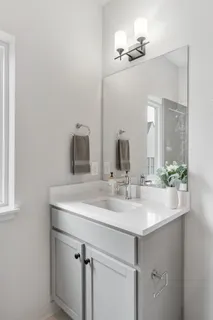 a view of a backyard with lawn chairs