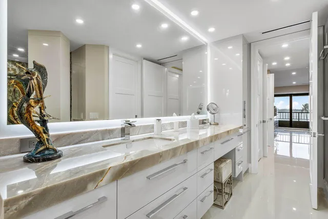 a bathroom with a tub sink toilet and shower