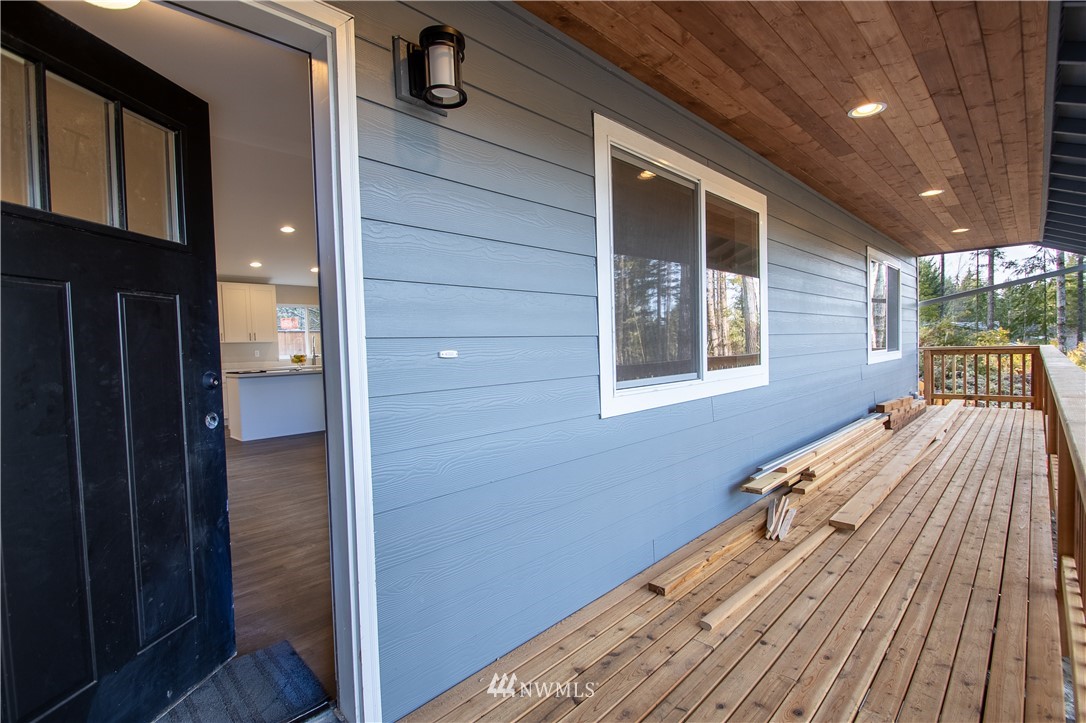 5031 East Rasor Road Belfair, WA 98528 - Photo 15 of 16 a view of balcony and wooden floor