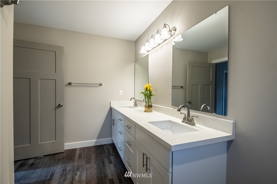 5031 East Rasor Road Belfair, WA 98528 - Photo 9 of 16 a bathroom with a sink and a mirror