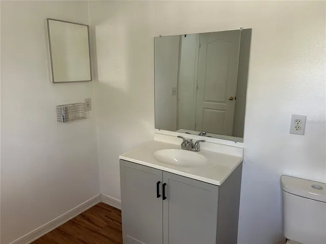 a bathroom with a sink and mirror