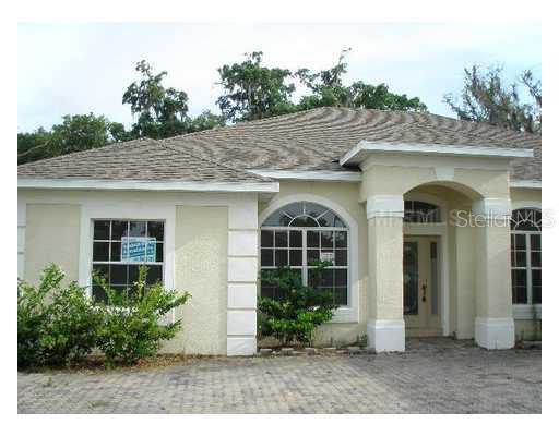2300 Rambling Oaks Way Kissimmee, FL 34746 - Photo 1 of 1 a front view of a house with garden