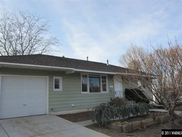 875 Lodge Avenue Reno, NV 89503 - Photo 1 of 13 a front view of house with yard