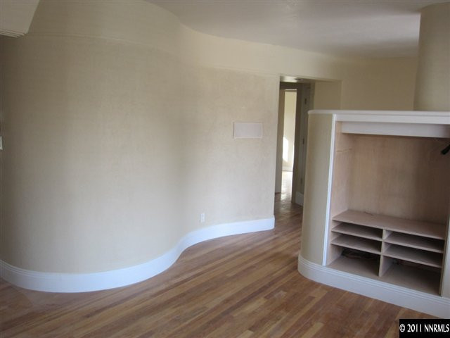 875 Lodge Avenue Reno, NV 89503 - Photo 4 of 13 a view of room with wooden floor and closet