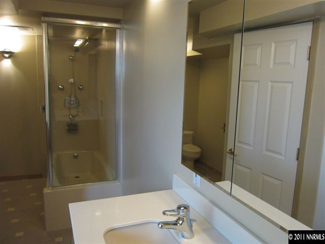 875 Lodge Avenue Reno, NV 89503 - Photo 7 of 13 a bathroom with a shower and a sink