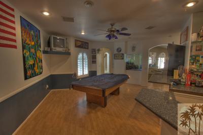 43094 Joshua Road Rancho Mirage, CA 92270 - Photo 11 of 25 a living room with furniture a flat screen tv and a wooden floor