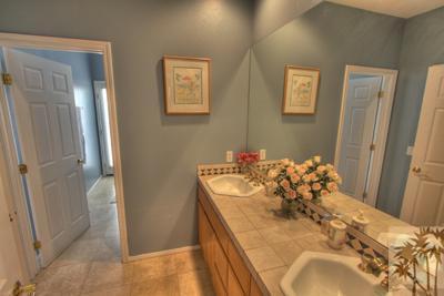 43094 Joshua Road Rancho Mirage, CA 92270 - Photo 13 of 25 a spacious bathroom with a sink and a mirror