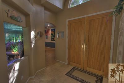 43094 Joshua Road Rancho Mirage, CA 92270 - Photo 3 of 25 a view of a hallway with furniture and a window
