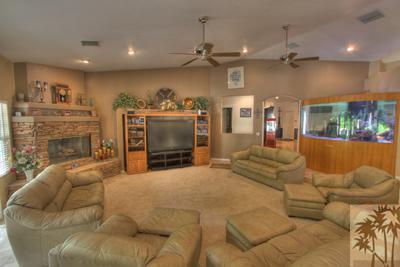 43094 Joshua Road Rancho Mirage, CA 92270 - Photo 4 of 25 a bed room with furniture and a fireplace