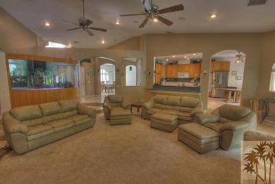 43094 Joshua Road Rancho Mirage, CA 92270 - Photo 5 of 25 a living room with furniture and a large window