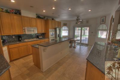 43094 Joshua Road Rancho Mirage, CA 92270 - Photo 8 of 25 a kitchen with a sink appliances cabinets and furniture
