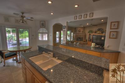 43094 Joshua Road Rancho Mirage, CA 92270 - Photo 9 of 25 a bathroom with a sink double vanity granite and a large mirror