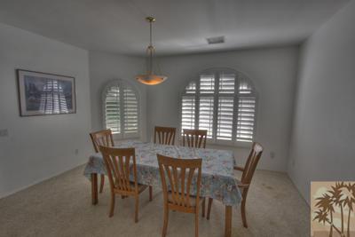 43094 Joshua Road Rancho Mirage, CA 92270 - Photo 10 of 25 a view of a dining room with furniture and window
