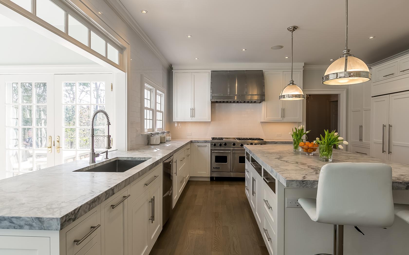 1601 Ponus Ridge Road New Canaan, CT 06840 - Photo 12 of 88 a large kitchen with stainless steel appliances granite countertop a sink a stove and a wooden floors
