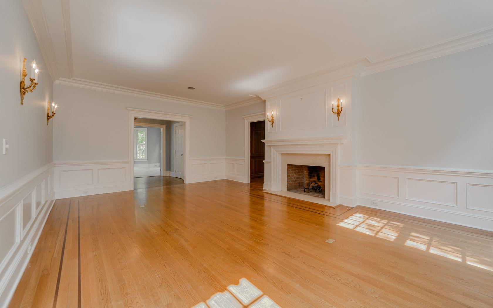 1601 Ponus Ridge Road New Canaan, CT 06840 - Photo 28 of 88 a view of empty room with wooden floor and fireplace