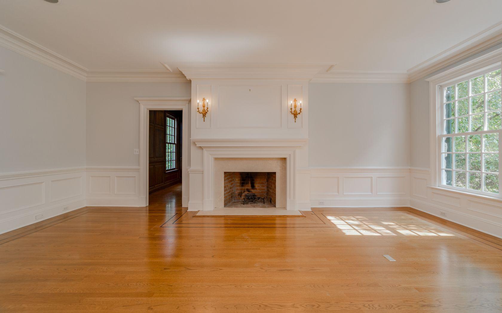 1601 Ponus Ridge Road New Canaan, CT 06840 - Photo 29 of 88 a view of an empty room with a fireplace and a window