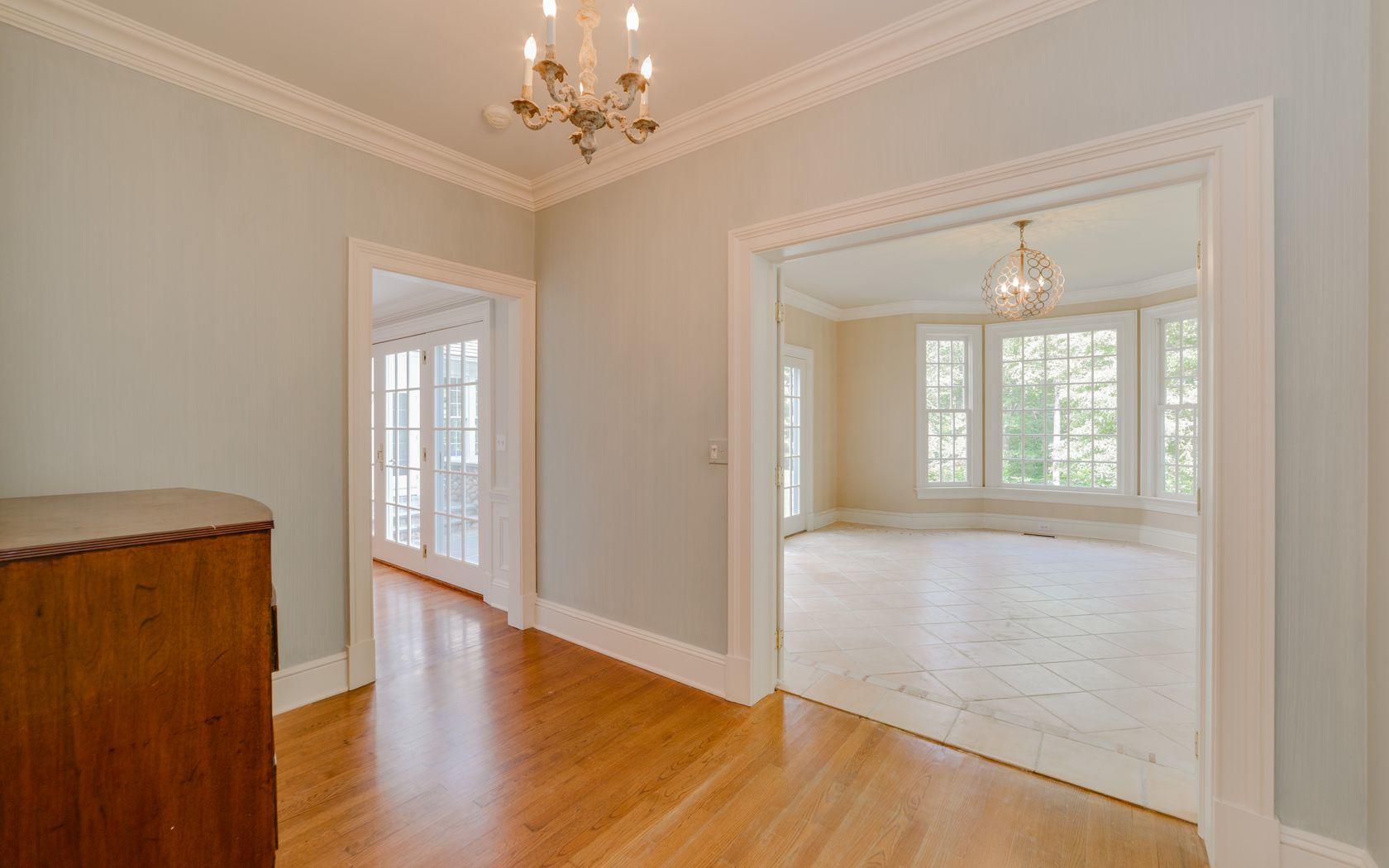 1601 Ponus Ridge Road New Canaan, CT 06840 - Photo 35 of 88 a view of an empty room with wooden floor and a window