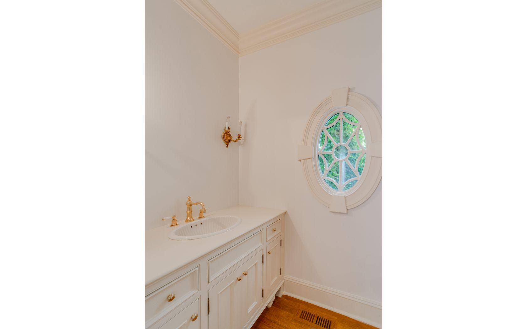 1601 Ponus Ridge Road New Canaan, CT 06840 - Photo 37 of 88 a bathroom with a sink a mirror and a shower